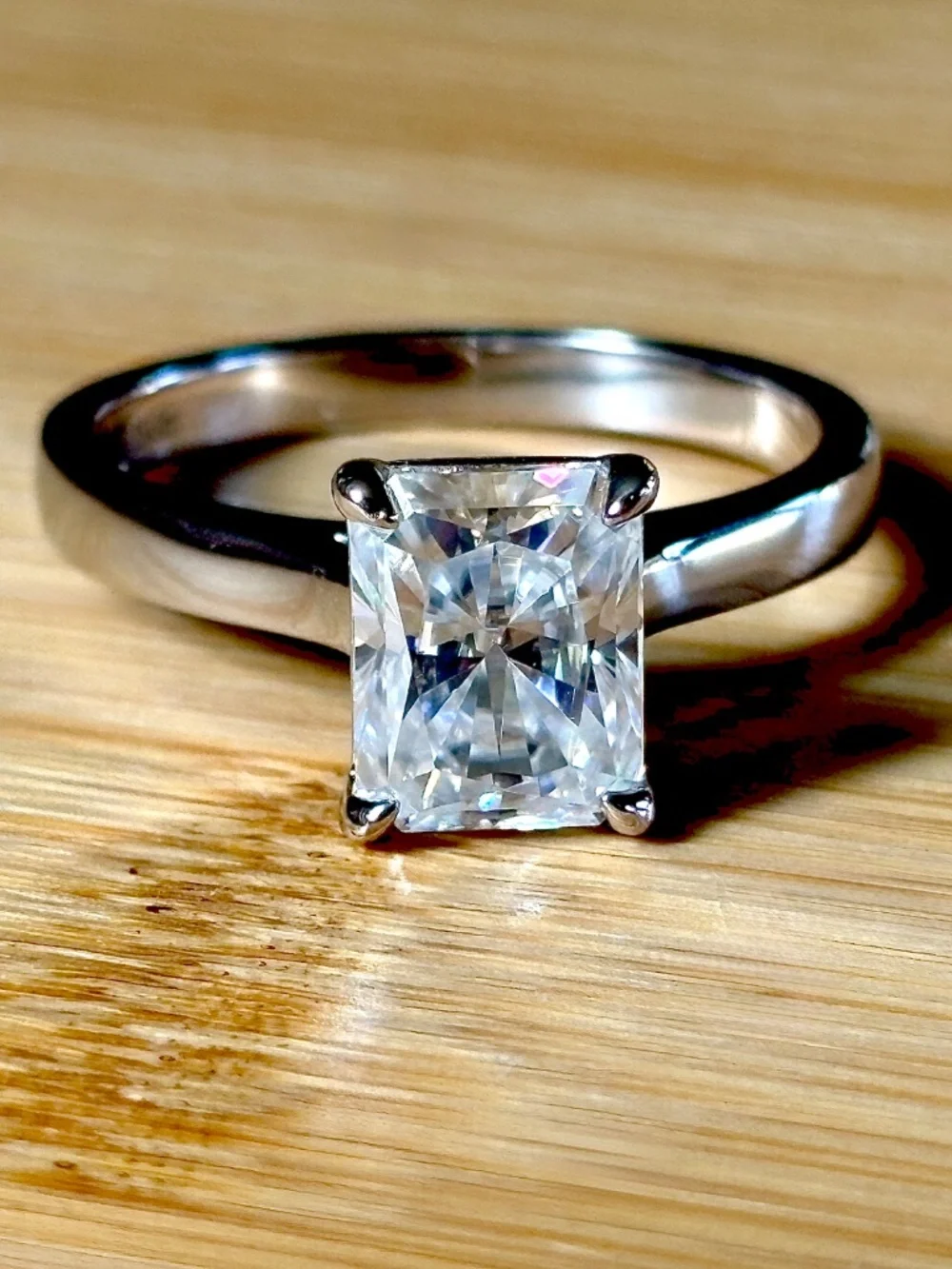 A certified 3ct radiant Moissanite solitaire in solid sterling silver and 18k!